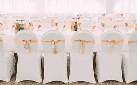 How Can Event Planners Use Floral Table Covers and Red Velvet Drapes to Elevate Wedding Décor?