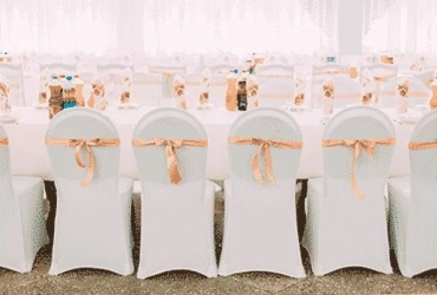 How Can Event Planners Use Floral Table Covers and Red Velvet Drapes to Elevate Wedding Décor?