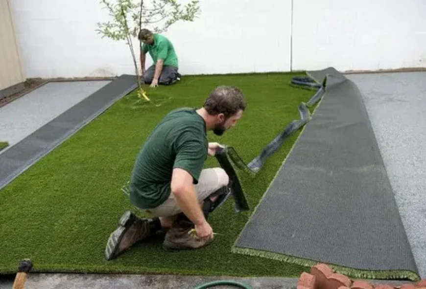 Artificial Grass and Stone Pathway Installation for Beautiful Outdoor Living Spaces
