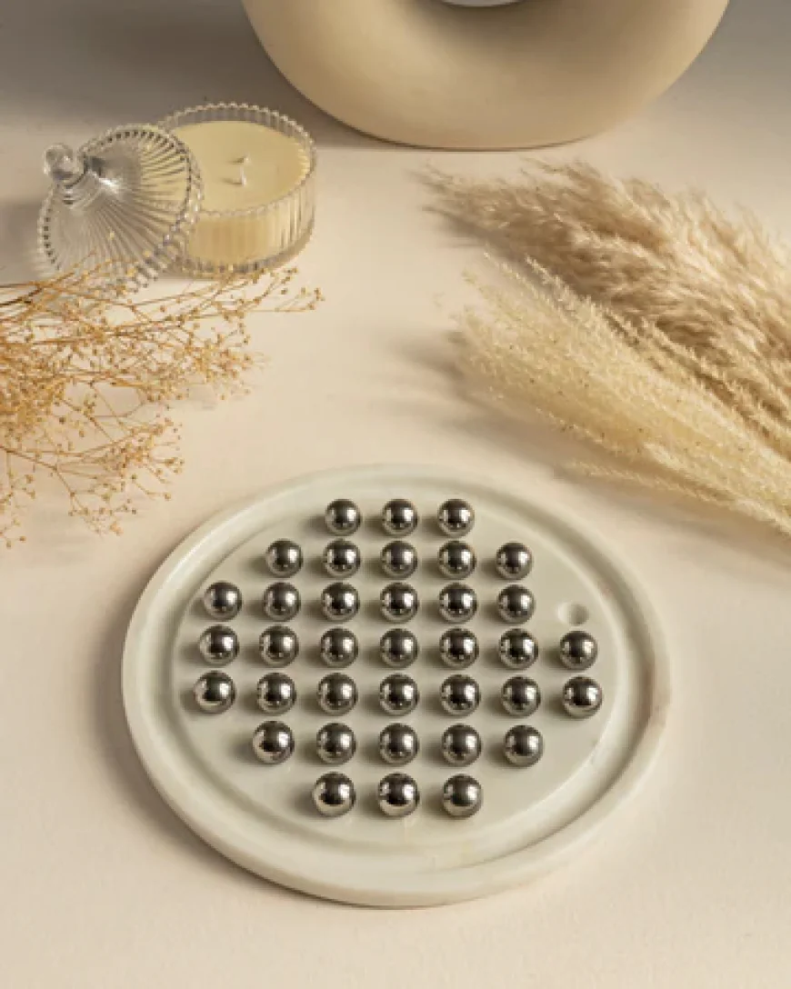 How Brain Games Help Improve Memory and Concentration with Marble Solitaire Game
