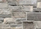 Create a cozy living space with natural stone features