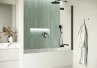 A bathroom gains composure when its boundaries are clear and dependable.