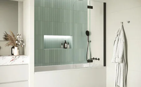 A bathroom gains composure when its boundaries are clear and dependable.
