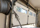 How a Frayed Garage Door Cable Can Turn a Small Repair Into an Off-Track Door